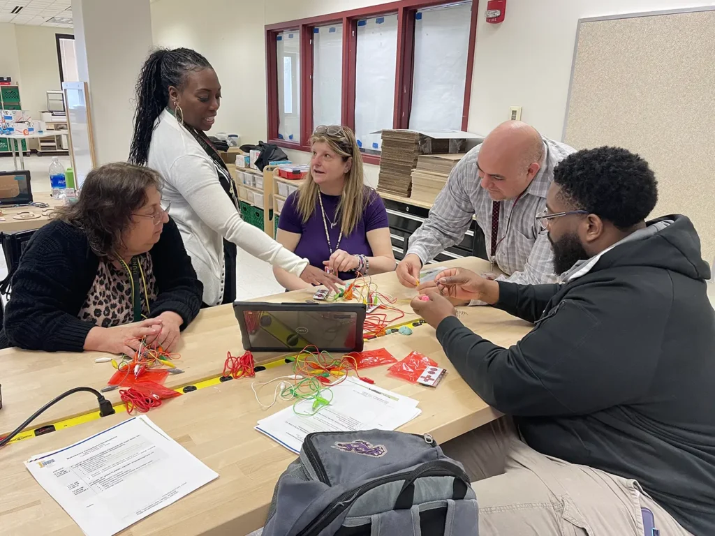 Teachers learning about makerspace projects through a professional development activity